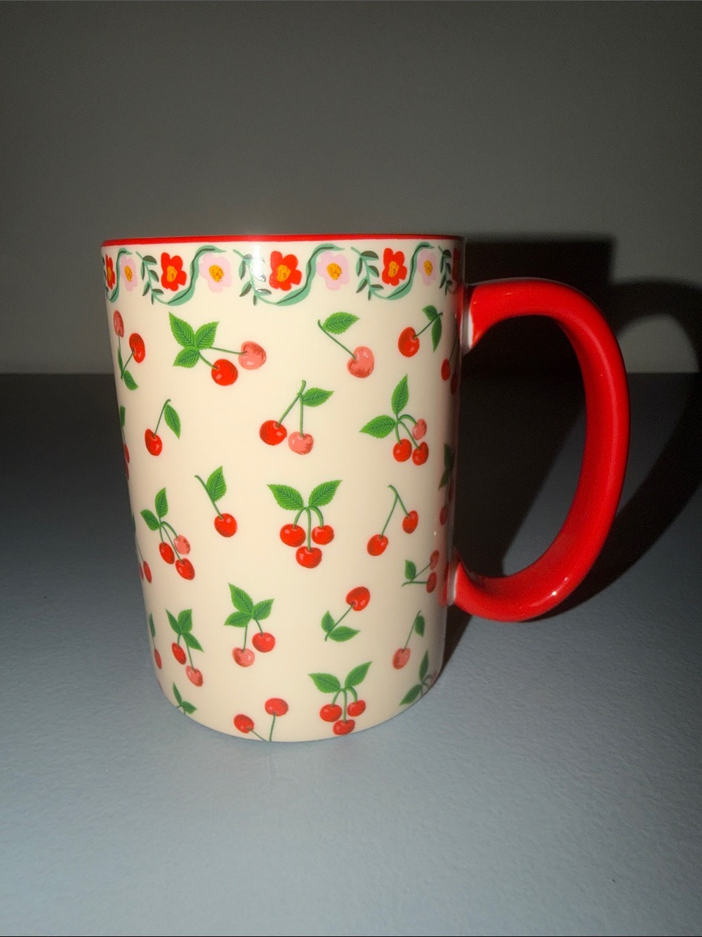 Rifle Paper Co. Cream Mug with Red Cherry Pattern and Red Handle